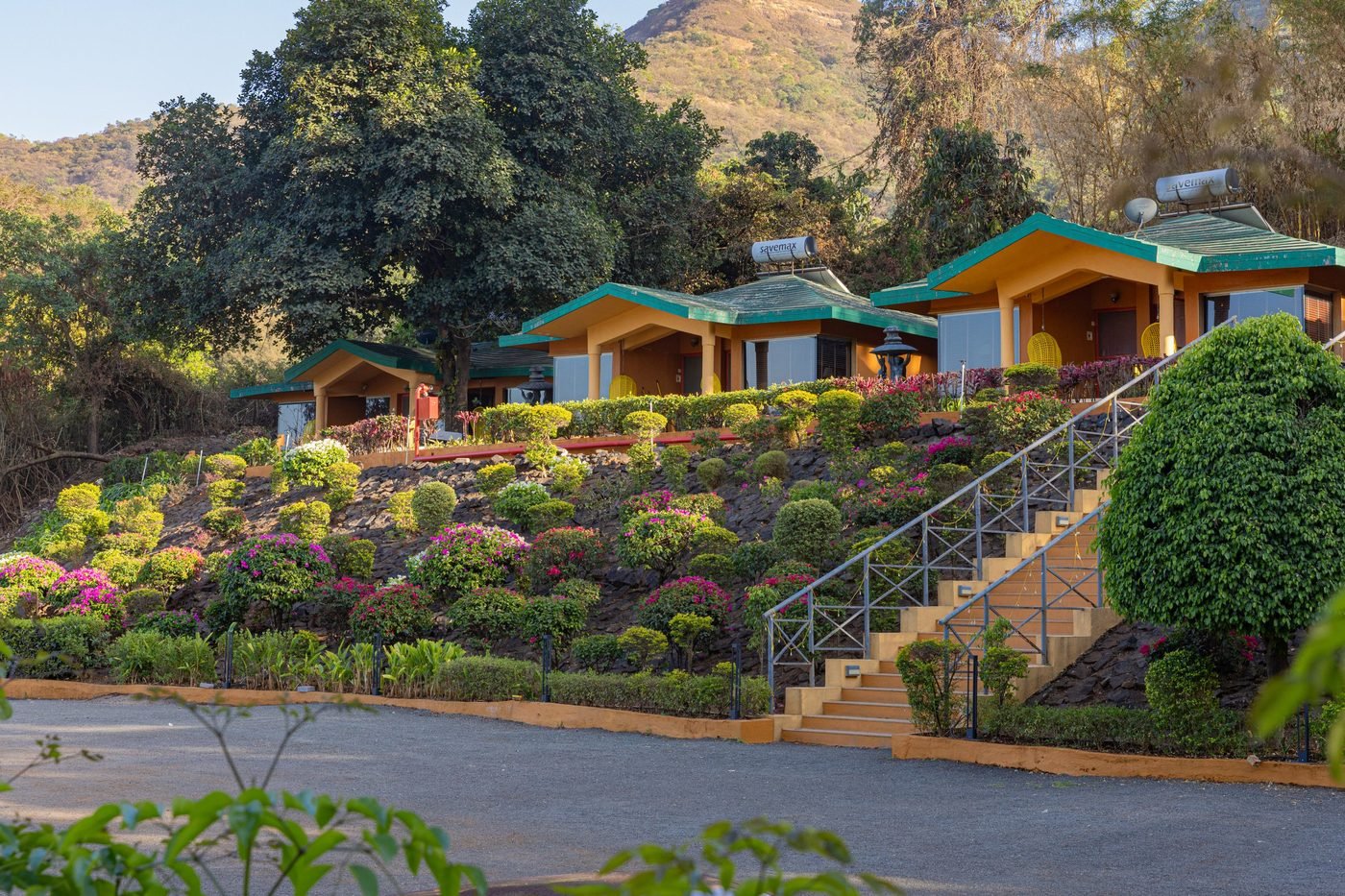 Garden cottages on a hillside at the Mulshi retreat